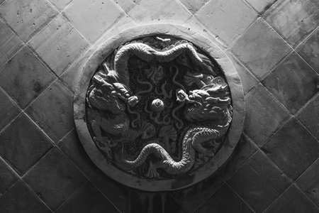 Double dragon wall stone carvingの写真素材