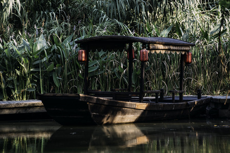 wooden boat in Xixi Wetland Parkの写真素材