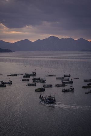 Seaside harbor and sunsetの写真素材