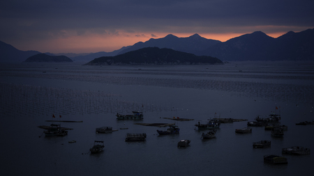 Seaside harbor and sunsetの写真素材