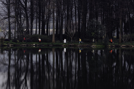 Children running on the lakeの写真素材