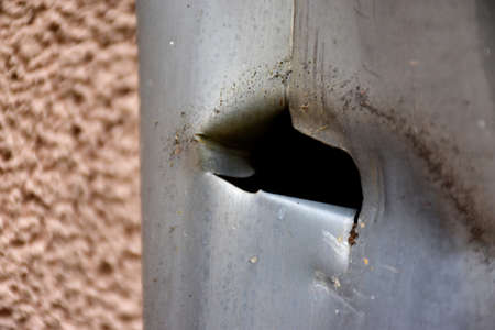 a hole in the gutterの写真素材