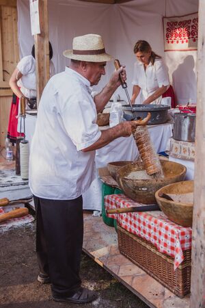 BUDAPEST, HUNGARY - OKTOBER 14, 2018: K rt skal cs Fesztiv l 2018. Bakers preparing and selling traditional hungarian pastry called kurtosh kallach in Budapest festival of Sekler cake on Oktober 12, 2018.のeditorial素材
