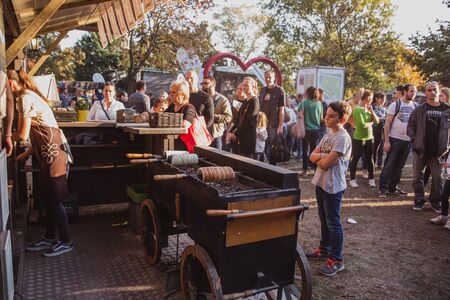 BUDAPEST, HUNGARY - OKTOBER 14, 2018: K rt skal cs Fesztiv l 2018. Bakers preparing and selling traditional hungarian pastry called kurtosh kallach in Budapest festival of Sekler cake on Oktober 12, 2018.のeditorial素材