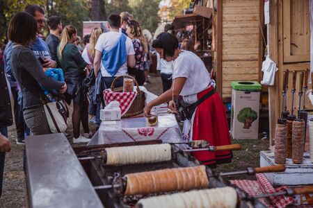 BUDAPEST, HUNGARY - OKTOBER 14, 2018: K rt skal cs Fesztiv l 2018. Bakers preparing and selling traditional hungarian pastry called kurtosh kallach in Budapest festival of Sekler cake on Oktober 12, 2018.のeditorial素材