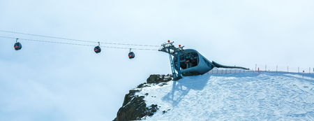 Winter landscape - Panorama of the ski resort with ski slopes and ski lifts. Alps. Austria. Pitztaler Gletscher. Wildspitzbahn. Winter seasonの写真素材