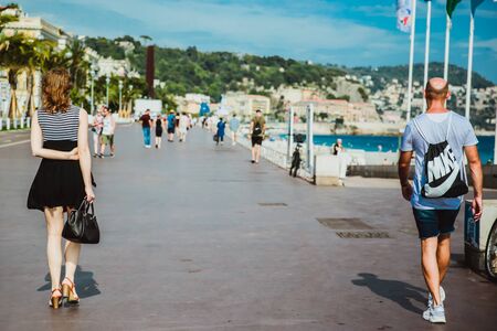 NICE, FRANCE - JUNE 26, 2017: Many tourists walk along the english promenade of French Riviera at the Mediterranean Seaのeditorial素材
