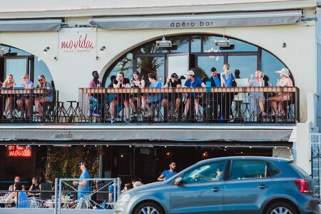 NICE, FRANCE - JUNE 26, 2017: Many tourists walk along the english promenade of French Riviera at the Mediterranean Seaのeditorial素材