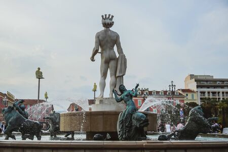 NICE, FRANCE - JUNE 26, 2017: Central Square in Nice, France on june 26, 2017. The Triton Fountain...
