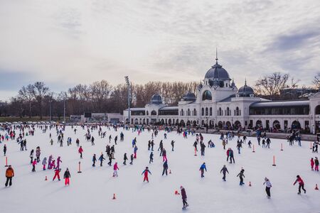 BUDAPEST, HUNGARY - DECEMBER 31, 2018: Many people spend their holidays skating in City Park ice rink in Budapest, Hungaryのeditorial素材