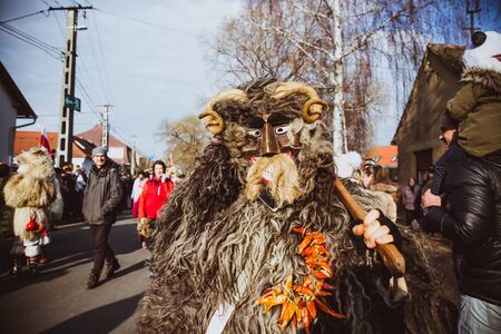 MOHACS, HUNGARY - FEBRUARY 11, 2018: Unidentified people in mask participants at the Mohacsi...