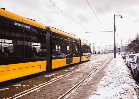 BUDAPEST, HUNGARY - DECEMBER 16, 2018: Yellow trams near the embankment on the Buda side in Budapest, Hungaryのeditorial素材