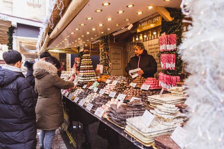 BUDAPEST, HUNGARY - DECEMBER 19, 2018: Tourists and local people enjoying the beautiful Christmas...