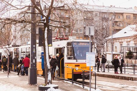 BUDAPEST, HUNGARY - 16 DECEMBER, 2018: Danube embankment with yellow tram from Buda side in winter in Budapest, Hungaryのeditorial素材