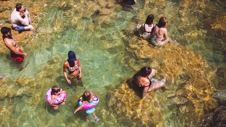 KRKA NATIONAL PARK, CROATIA - AUG 13, 2015: Plenty of tourists enjoy swimin in Krka waterfalls in the Krka National Park in Croatiaのeditorial素材