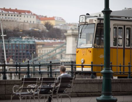 BUDAPEST, HUNGARY - JANUARY 2018: Yellow tram on the promenade of Budapest, Hungary on January 18, 2018. Budapest is the capital and the largest city of Hungaryのeditorial素材