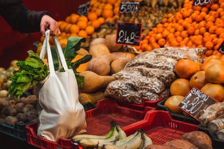 Shopping with eco shopper bag at street market, eco conceptの写真素材