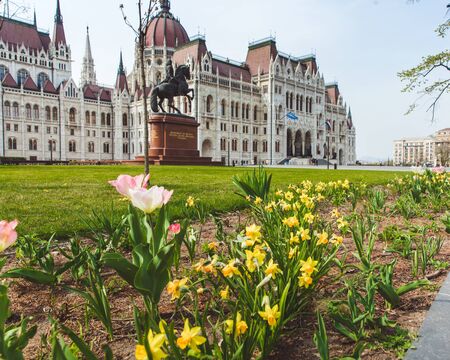 BUDAPEST, HUNGARY - APRIL 03, 2019: Tourists walking near the Parliament Hungary ,Budapestのeditorial素材