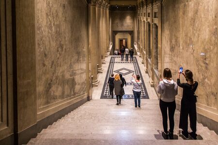 BUDAPEST, HUNGARY - APRIL 03, 2019: Many tourists stroll indoor of Fine Arts Museum in Budapest, Hungaryのeditorial素材