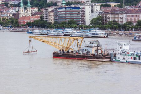 BUDAPEST, HUNGARY - MAY 30, 2019: Rescue operation on the Danube River near the Margit bridge after the tragedy of May 29 in Budapest, Hungary. Two ships collided on the river.のeditorial素材