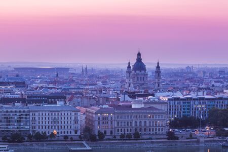 Panoramic cityscape of Saint Stephen basilica on the Danube river. Colorful sunrise in Budapest, Hungaryの写真素材