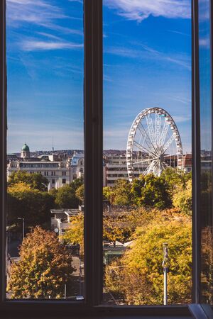 View from the window to Budapest Eye and St. Stephens Basilica in Budapest, Hungary