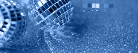 Classic Blue background, Close-up Crystal ball Decorated on Christmas night on a shiny background....