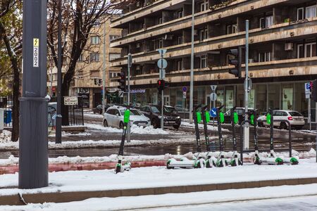 Budapest, Hungary, 2 December 2019: Lime-S electric scooter of the company Lime in the street in Budapest in winter with snowのeditorial素材