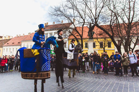 BUDAPEST - MARCH 15: Performance of artists on stilts on a street in the Buda Castle on the day of the Hungarian National Revolution on March 15, 2019 in Budapest.のeditorial素材