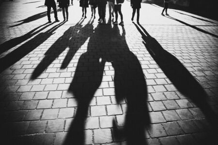 Shadows of people walking in a street of the city, Budapestの写真素材
