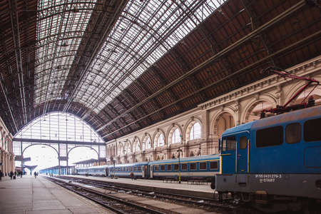 BUDAPEST, HUNGARY - 25 Juanary 2019: Locomotives and coaches and passengers on the Keleti Railway Station in Budapest, the oldest in Europe.