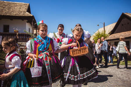 HOLLOKO, HUNGARY - April 12, 2019: Easter festival in the folklore village of Holloko in Hungary. Girls dressed in national costumesのeditorial素材