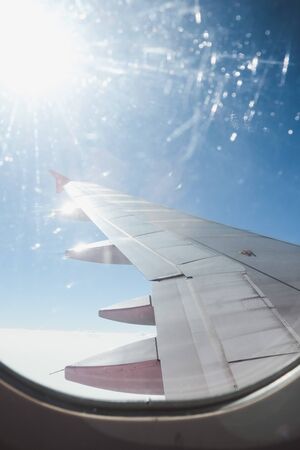 View of beautiful cloud and wing of airplane from window