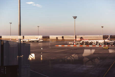 BUDAPEST - February 26, 2019: Airplane Ryanair at the terminal gate ready for takeoff in the Budapest Liszt Ferenc International Airport during sunset on February 26, 2019 in Budapest.のeditorial素材