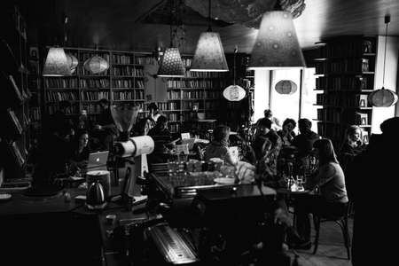 BUDAPEST, HUNGARY - October, 2018: Interior of a cafe bar with books on walls, black and white...