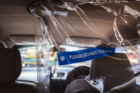 Bangalore, India - June 08, 2020. Safety panel inside taxi for social distancing, India, Bengaluru....