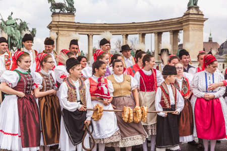BUDAPEST, HUNGARY, 06 APRIL 2019: Spring celebration parade through the Budapest streets. Folk Dancers in national costumes in the Heroes Squareのeditorial素材
