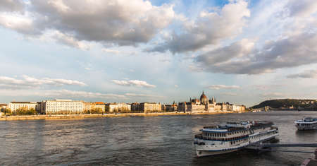 Budapest, Hungary. April 2018: View of the Hungarian Parliament from the Margaret Bridge in Budapest, a boat hotel standing on the shores of Buda in the foreground.のeditorial素材
