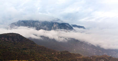 Mountain landscape with cloudy sky in Italyの写真素材