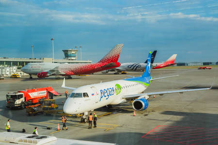 Russia, Moscow, Sheremetyevo airport, August 16, 2021. A Pegasus plane is at the airport, employees are preparing to leave passengers, take out their luggageのeditorial素材