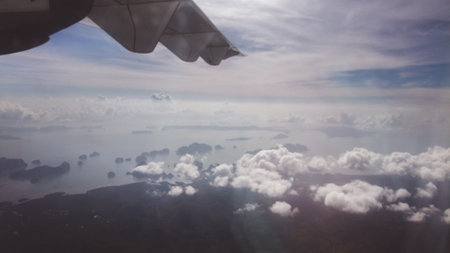 Skyline View above the Clouds from air planeの写真素材