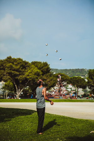 NICE, FRANCE - JUNE 26, 2017: Juggler with balls outdoors in Nice parkのeditorial素材
