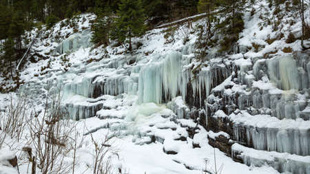 Small frozen waterfalls in the mountains, Slovakiaの写真素材