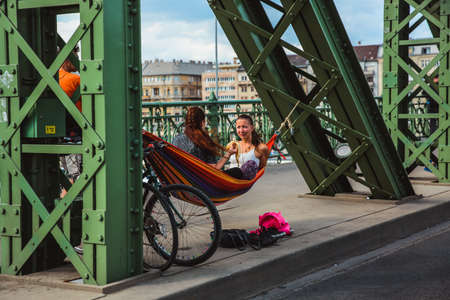 Budapest, Hungary - June 18, 2017: Unidentified people enjoying summer on Liberty Bridge, one of oldest bridge in Hungarian capital. The bridge closed for transport on weekends.のeditorial素材