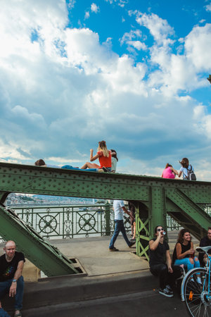 Budapest, Hungary - June 18, 2017: Unidentified people enjoying summer on Liberty Bridge, one of oldest bridge in Hungarian capital. The bridge closed for transport on weekends.のeditorial素材