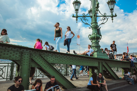 Budapest, Hungary - June 18, 2017: Unidentified people enjoying summer on Liberty Bridge, one of oldest bridge in Hungarian capital. The bridge closed for transport on weekends.のeditorial素材