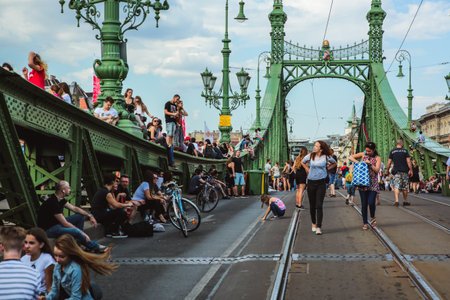Budapest, Hungary - June 18, 2017: Unidentified people enjoying summer on Liberty Bridge, one of oldest bridge in Hungarian capital. The bridge closed for transport on weekends.のeditorial素材