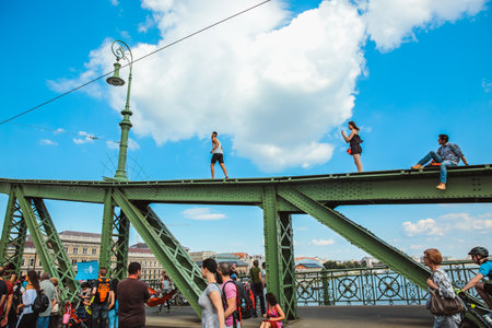 Budapest, Hungary - June 18, 2017: Unidentified people enjoying summer on Liberty Bridge, one of oldest bridge in Hungarian capital. The bridge closed for transport on weekends.のeditorial素材