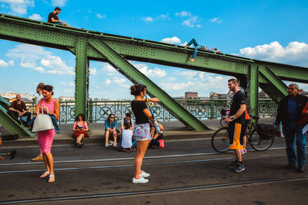 Budapest, Hungary - June 18, 2017: Unidentified people enjoying summer on Liberty Bridge, one of oldest bridge in Hungarian capital. The bridge closed for transport on weekends.のeditorial素材