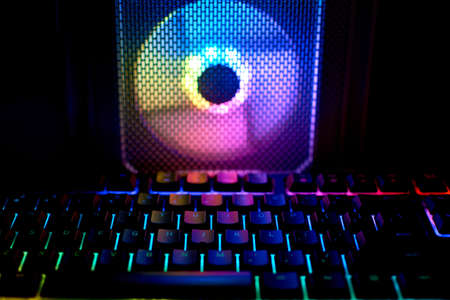 Game PC cooler with RGB LED light. Coolers and gaming PC keyboard with colorful neon light,...